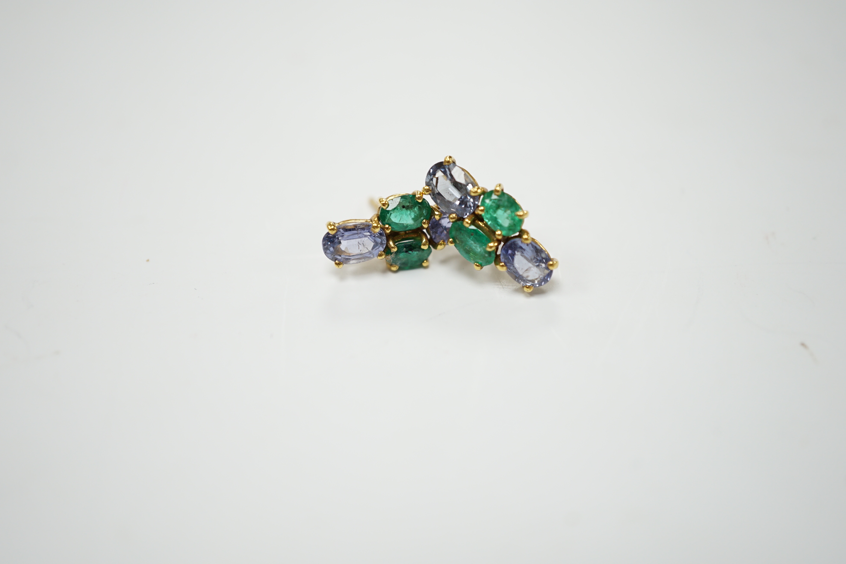 A modern pair of 18ct gold, two stone emerald and two stone sapphire set ear studs, 15mm by 7mm, gross weight 3 grams.